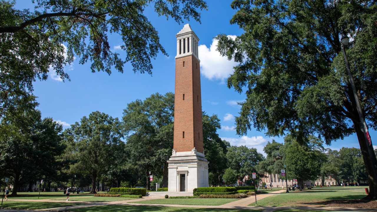 Street view of Denny Chimes with Gorgas Library in the background.