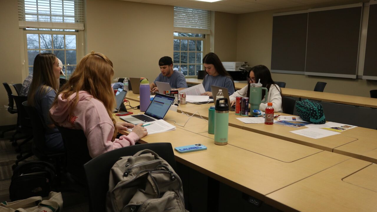 A group of Capstone Agency students work on a communications plan for a local nonprofit