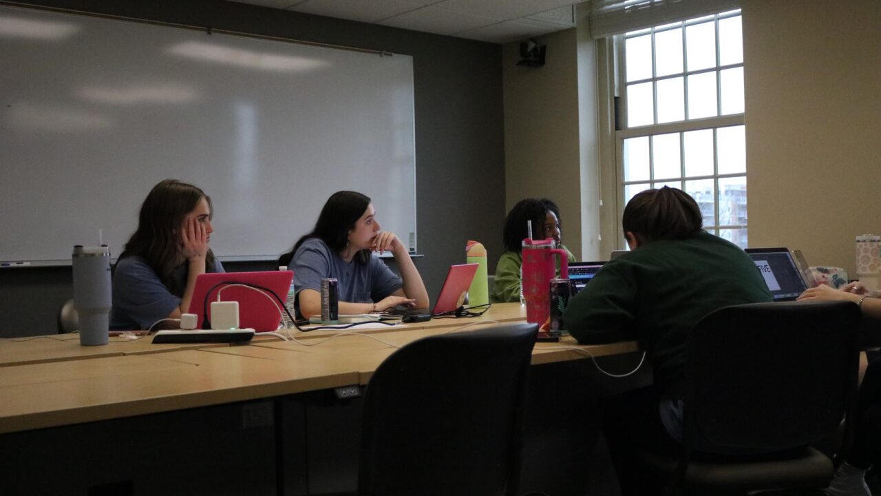 A group of Capstone Agency students work on a communications plan for a local nonprofit