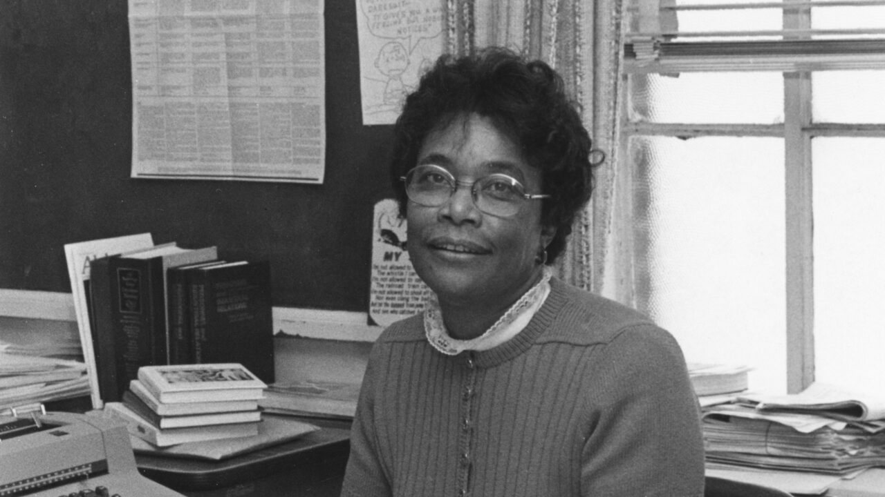 black and white photograph of Dr. Lena Prewitt at her desk