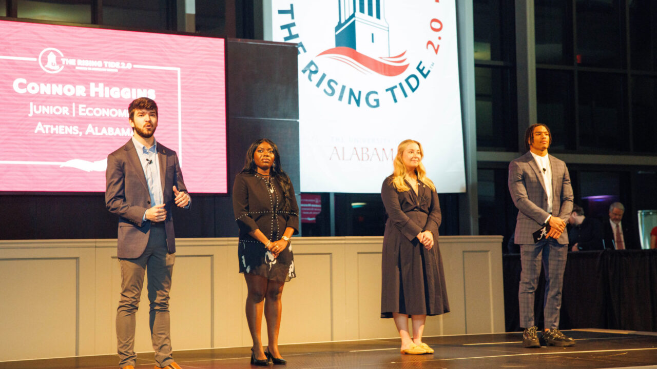 Four students stand on stage during an announcement of The Rising Tide 2.0 capital campaign.