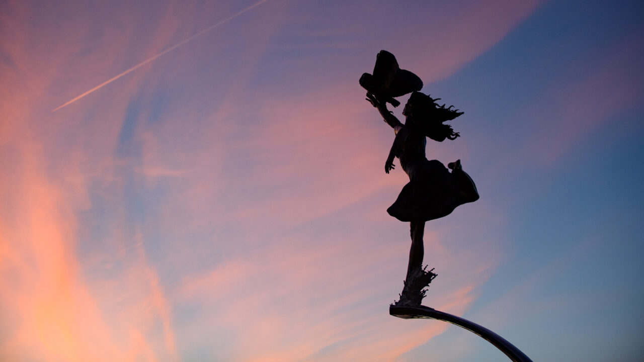 silhouette of Minerva statue at sunset