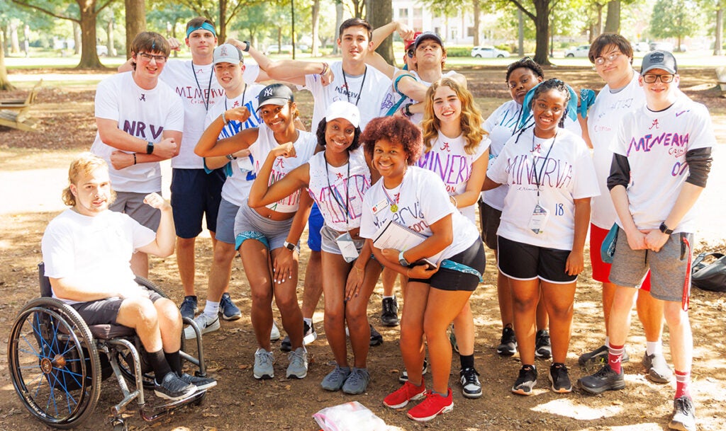 A group of students pose on the Quad at The University of Alabama.