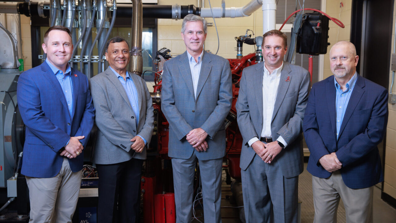 Dr. Joshua Bittle, Dr. Ajay Agrawal, John Driscoll, Dr. Brian Boudouris, and Tim Haskew, Associate Dean for Research, College of Engineering stand in front of the diesel combustion lab