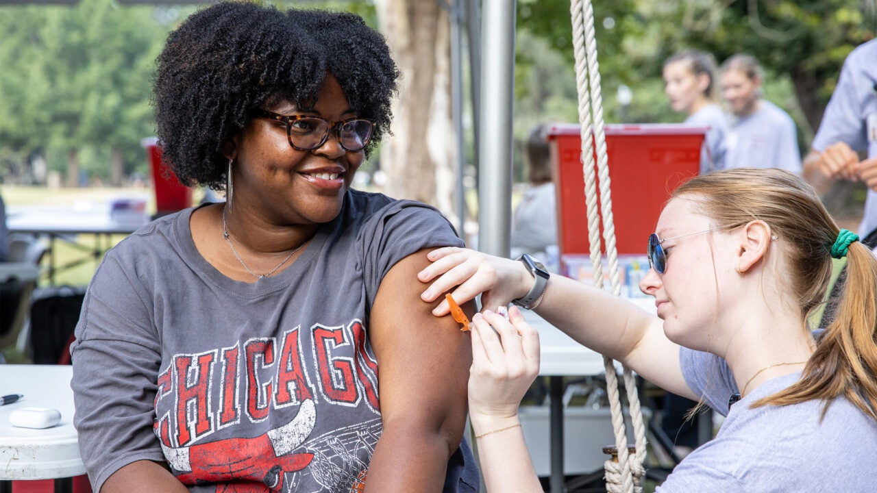 A student receiving her flu shot