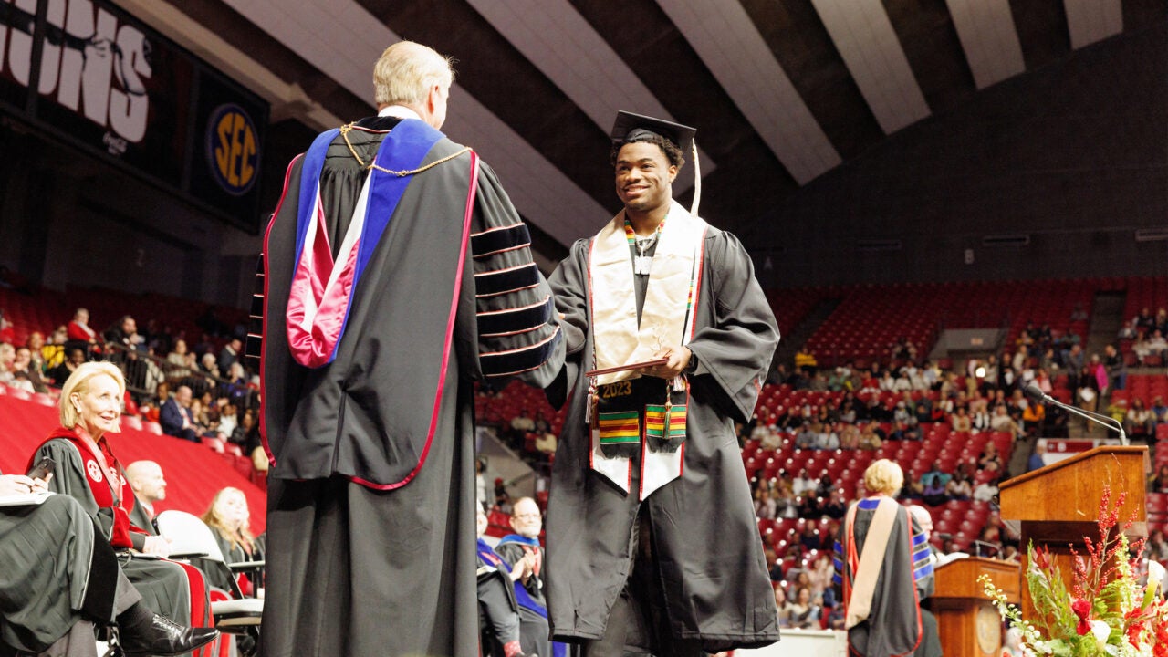 Jalen Milroe receiving his degree during commencement