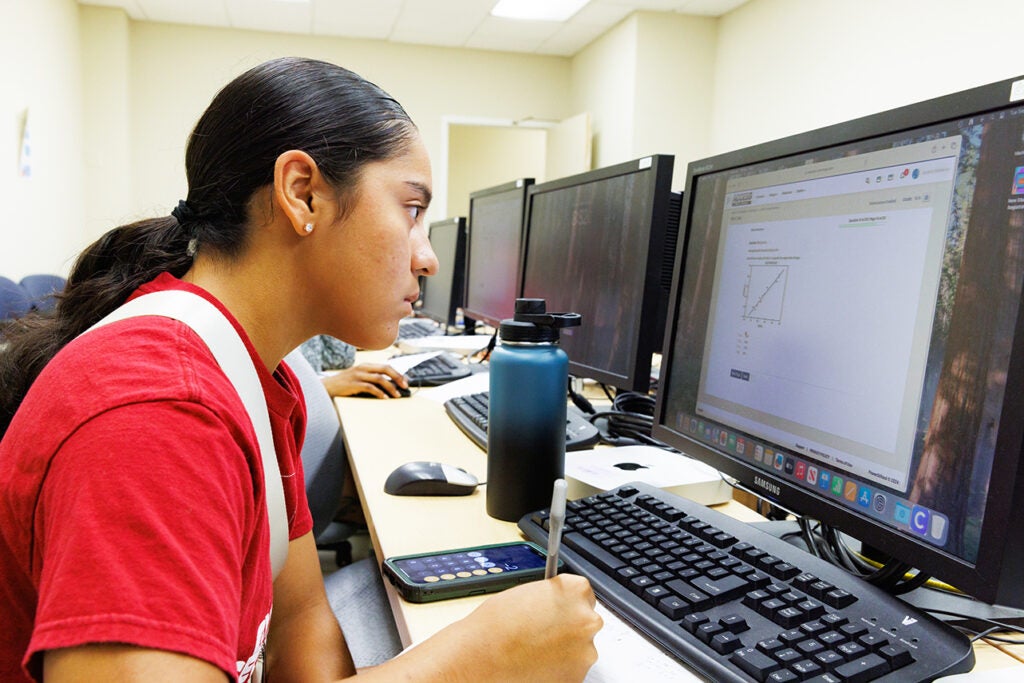 Jaslene Belden using a computer for virtual learning.