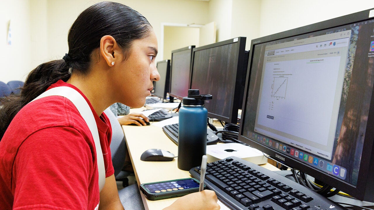 Jaslene Belden using a computer for virtual learning.