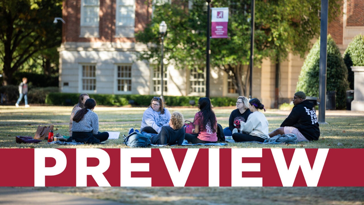 Students talking in a circle on the quad