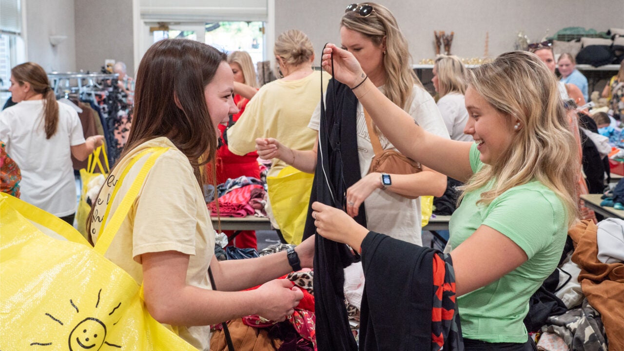 Shoppers looking at items at a previous Buy for RISE event