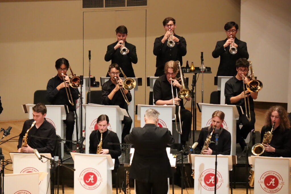 UA student musicians play horns at a concert at Moody Music Hall.