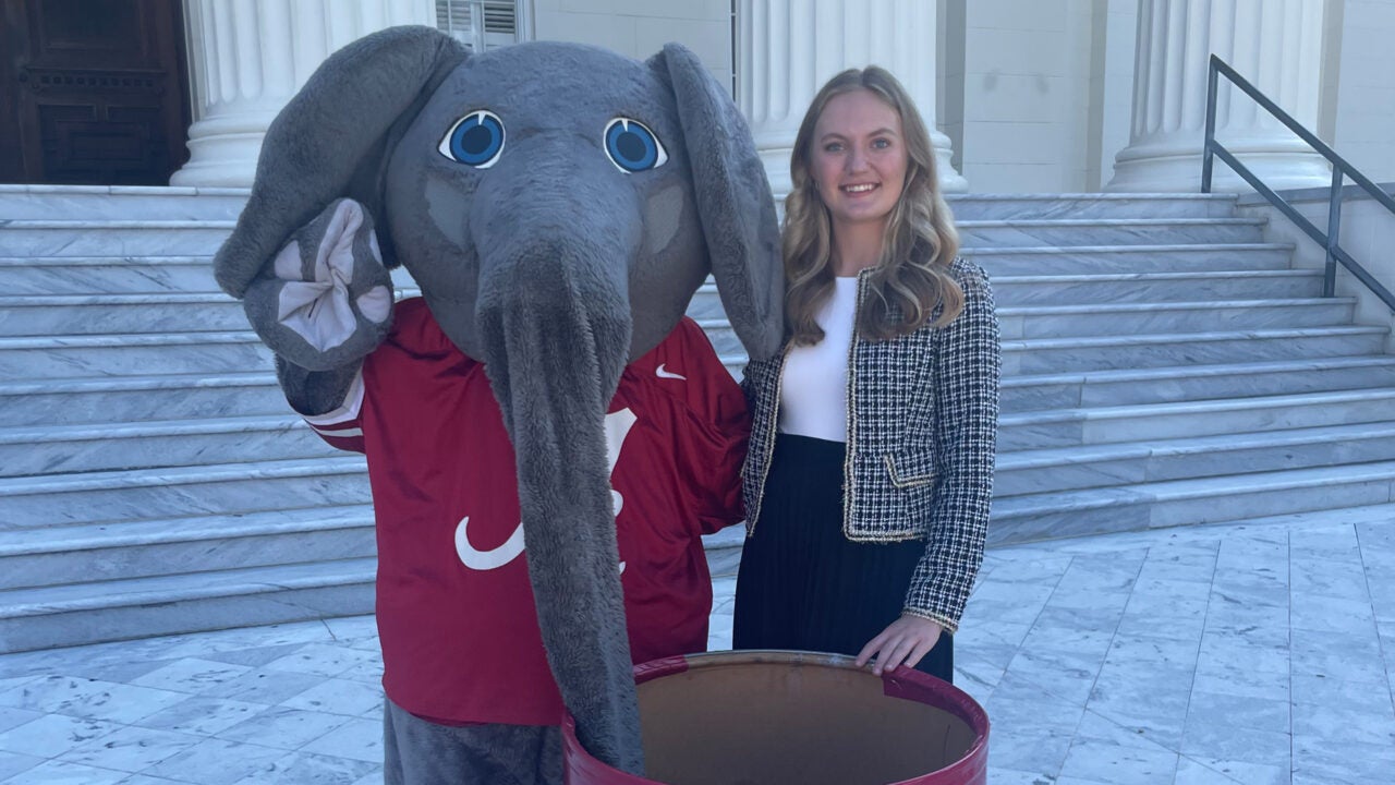 Kennedi Preston and Big Al at the Beat Auburn Beat Hunger kickoff event