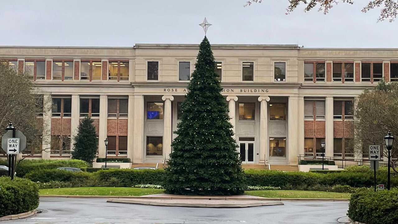 A tall Christmas tree in front of Rose Administration Building.