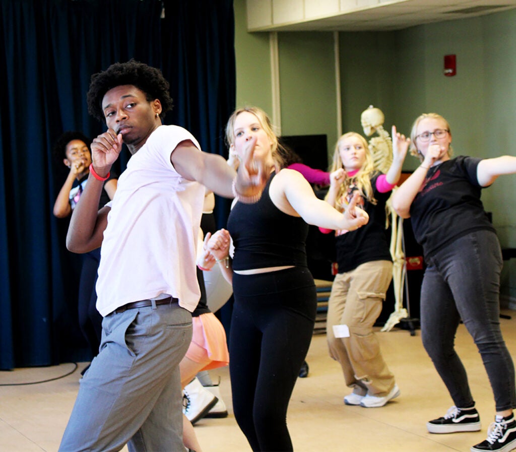 A small group of students perform. 