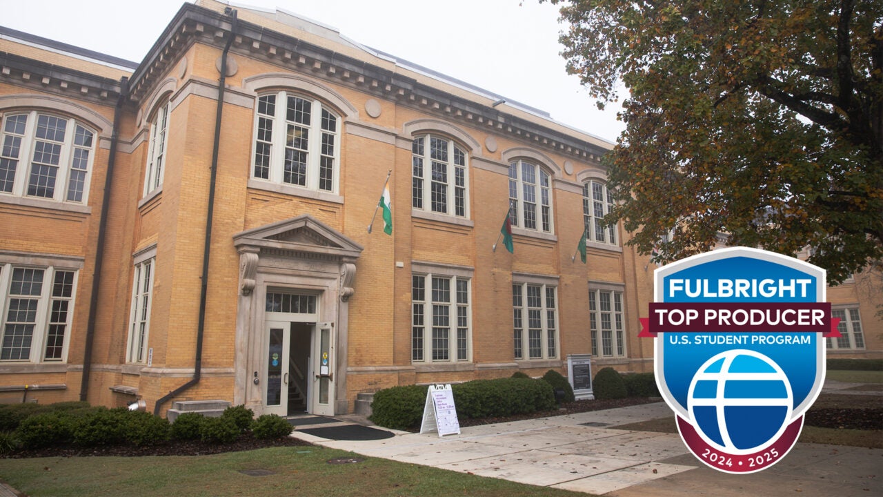 The front exterior of B B Comer Hall with the Fulbright Top Producer logo in the foreground