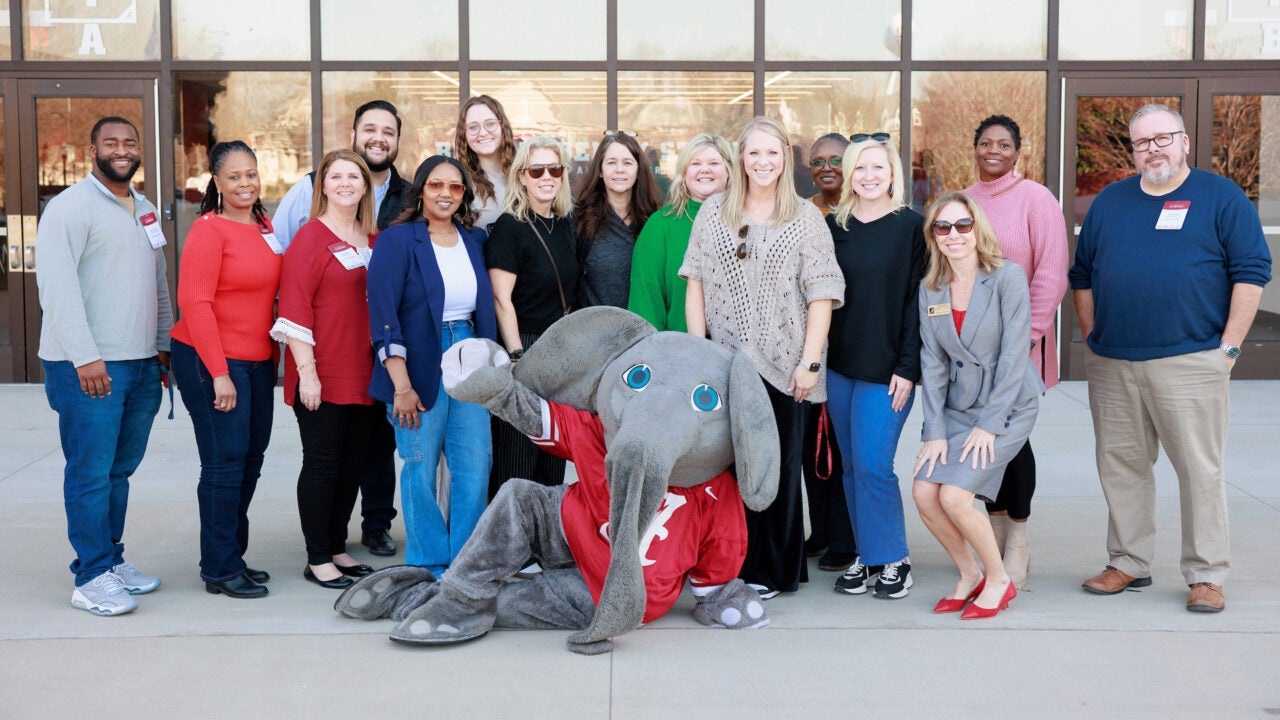 Several counselors posing with Big Al in front of Bryant Denny Stadium