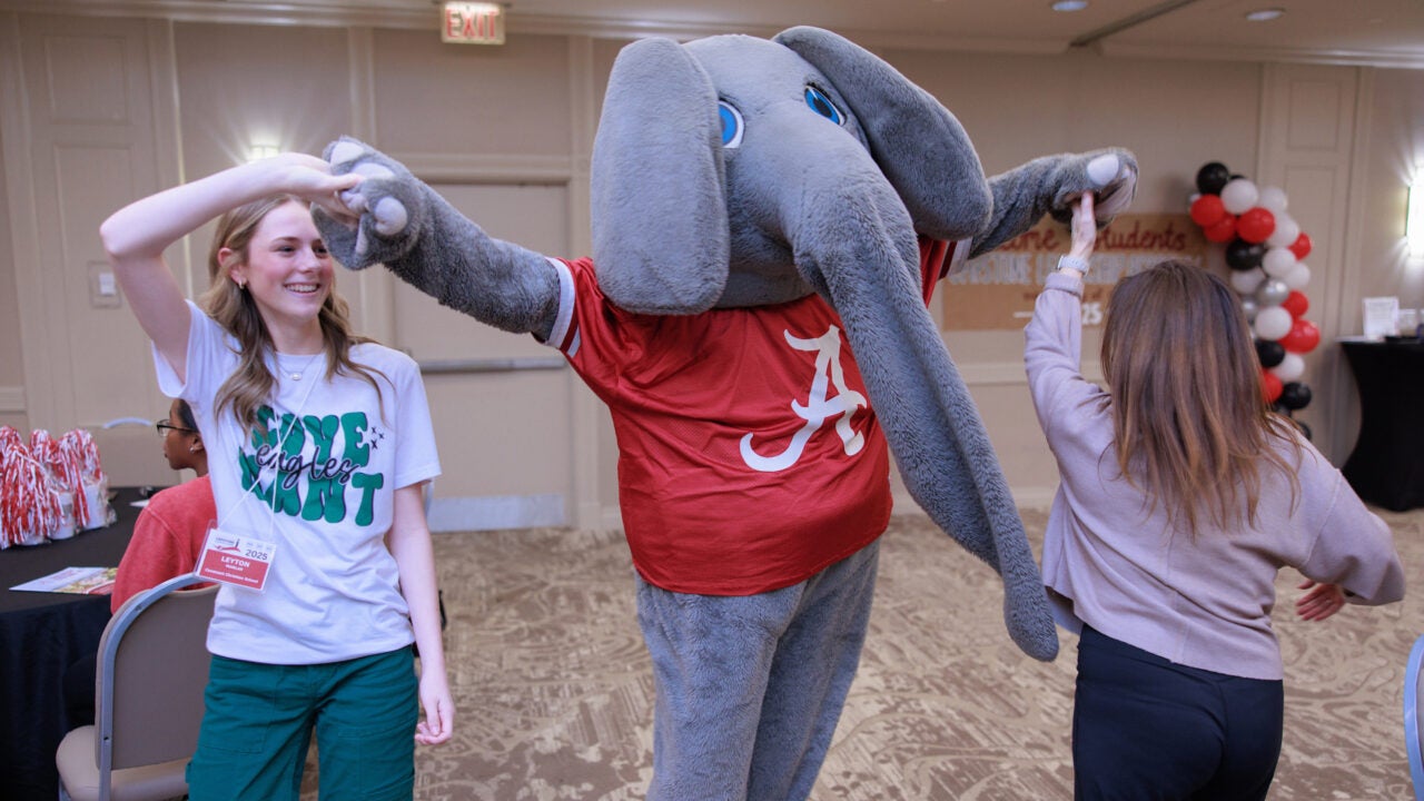 Big Al dancing with Capstone Leadership Academy participants