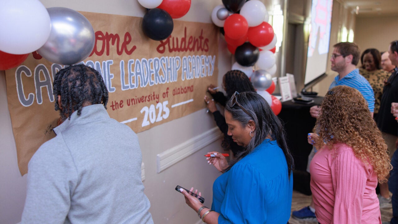 Capstone Leadership Academy participants signing a poster