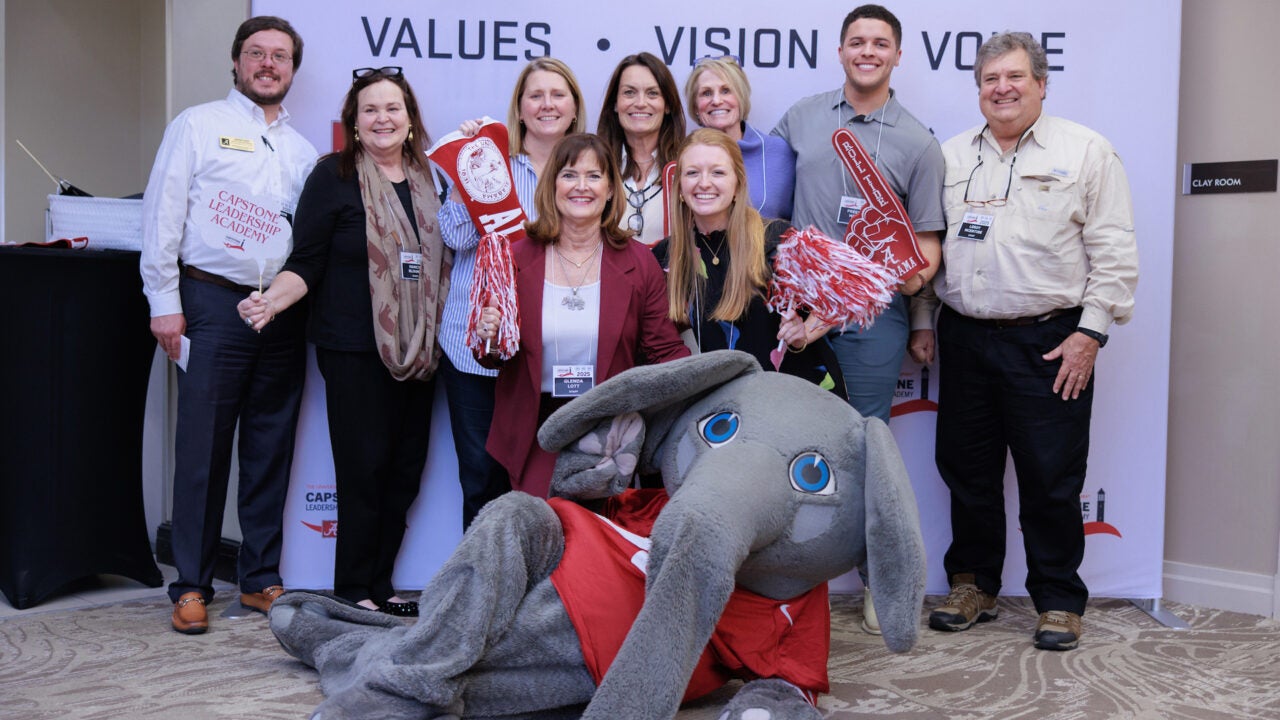 A group of Capstone Leadership Academy organizers with Big Al