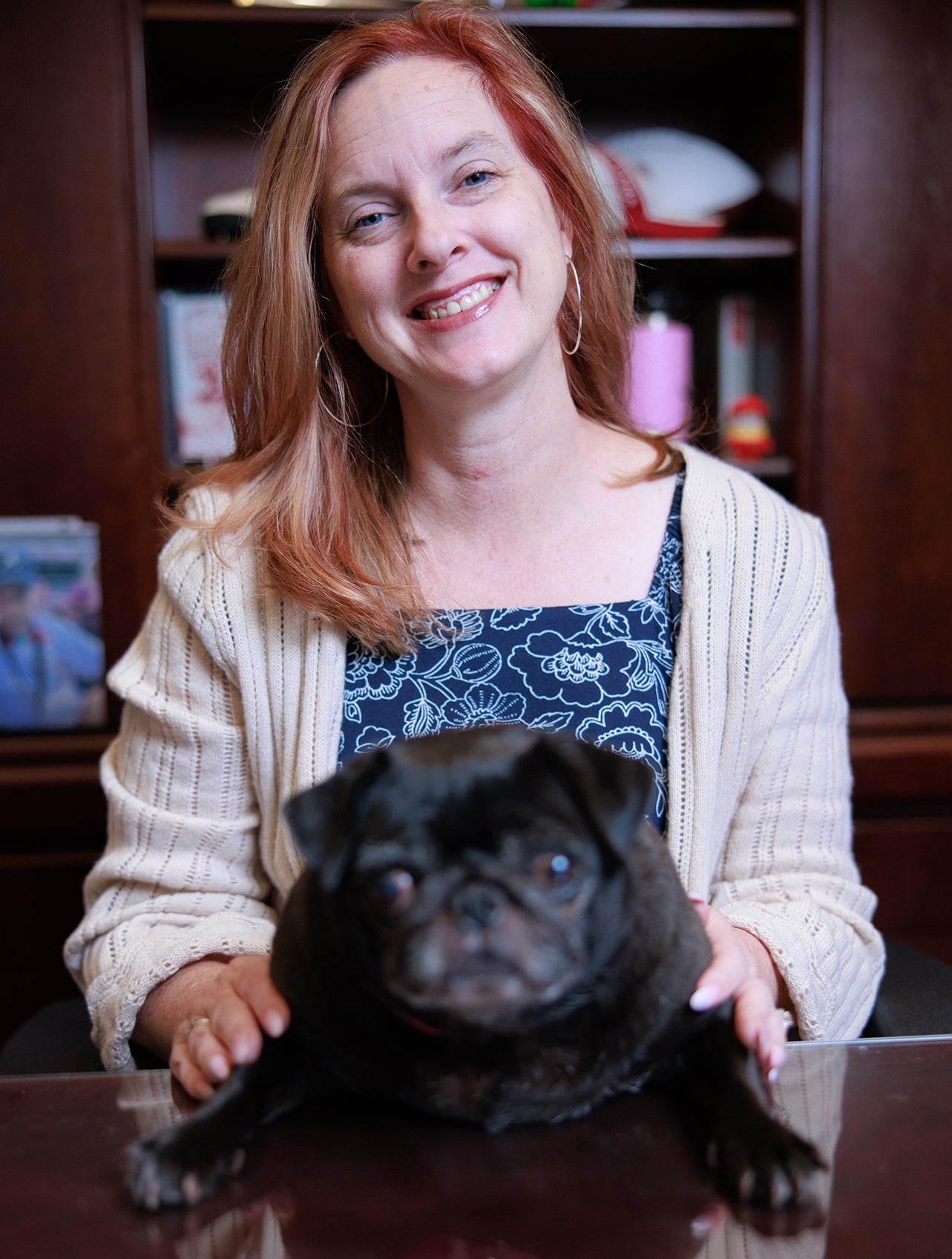 Olivia Arnold and her service animal Scout, a pug.
