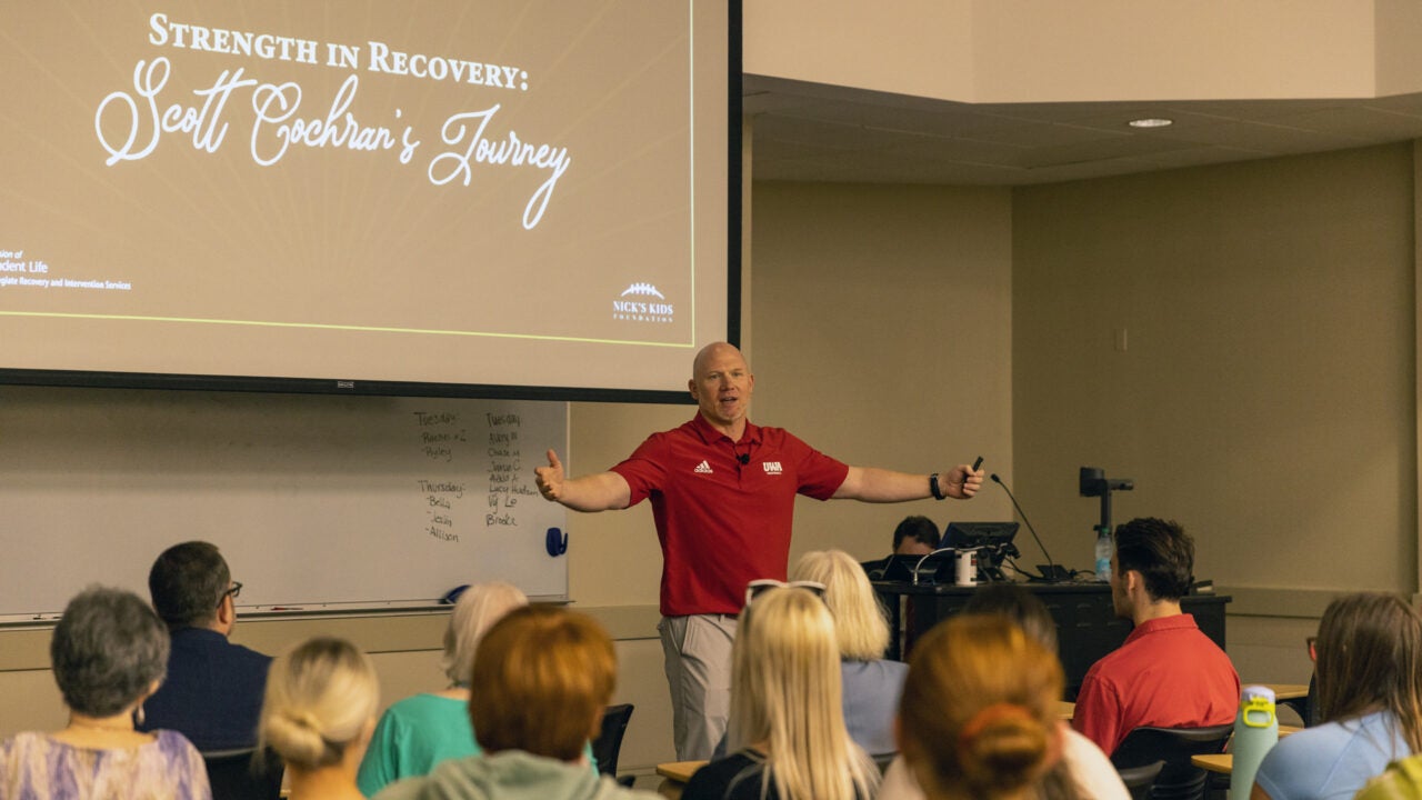 Scott Cochran addresses a room of students