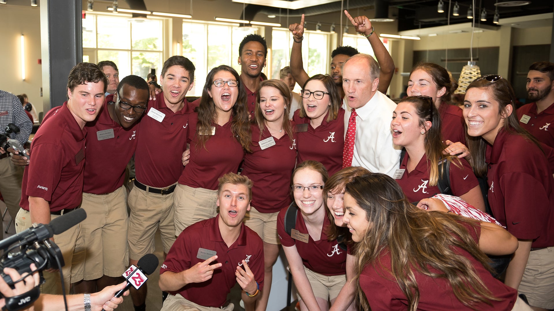 Dr. bell poses with a large group of students on his first day
