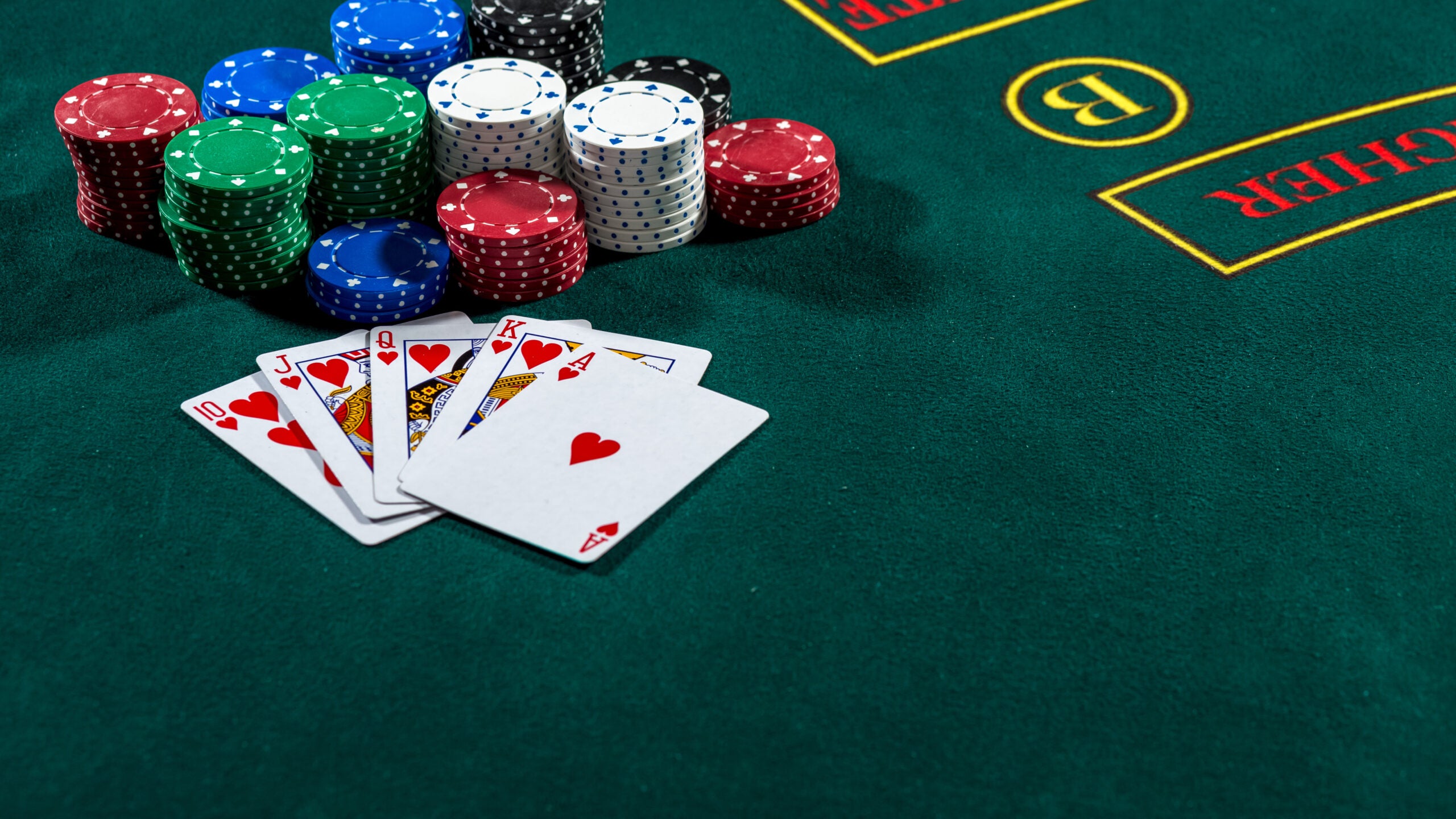 Poker chips and a hand of cards represent business strategies to discourage fraud