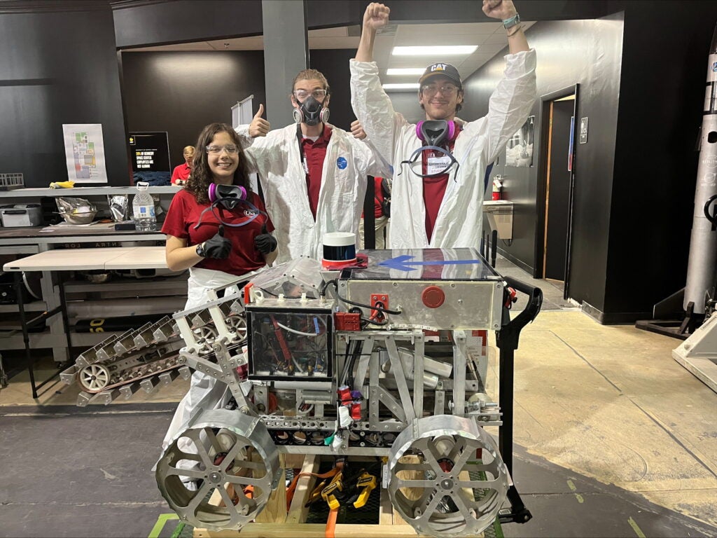 Members of the UA lunar robotics team with the UA rover.
