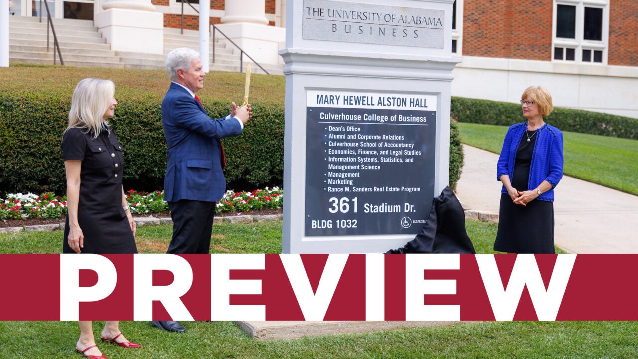 Rance Sanders and others watching the unveiling of the new Alston Hall sign following the naming ceremony