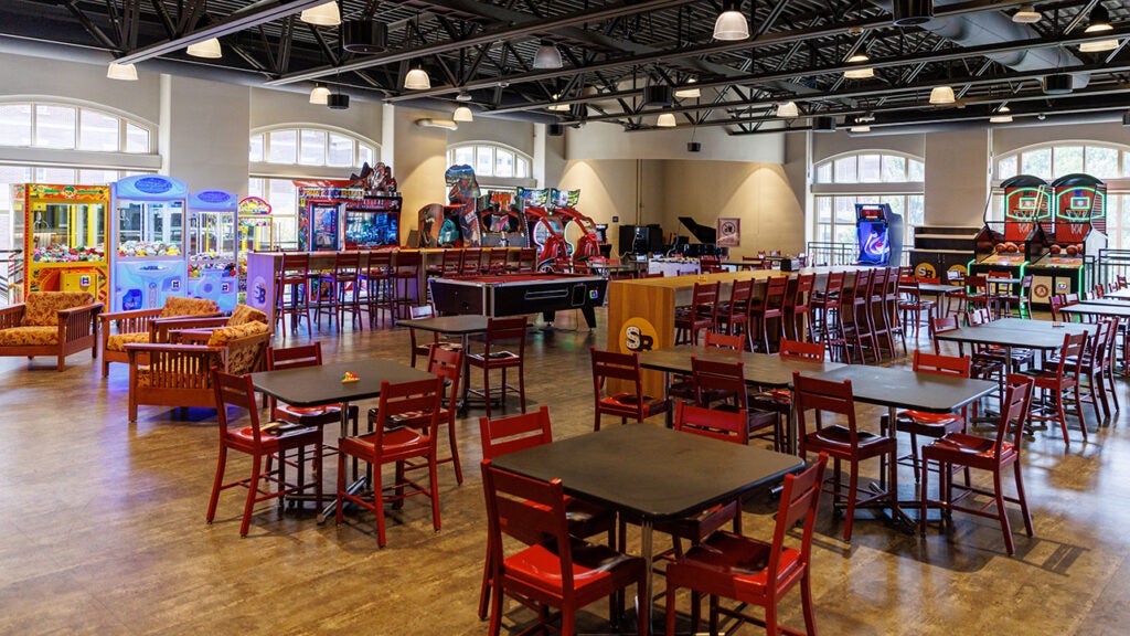 A wide shot of a dining and gaming area.