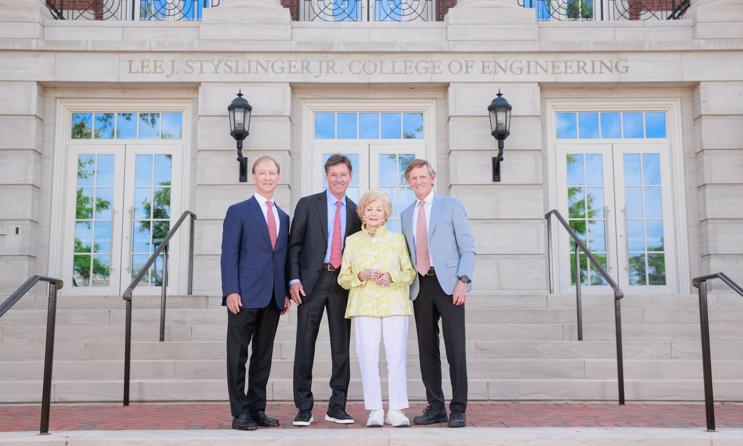 Styslinger family in front of H.M. Comer Hall