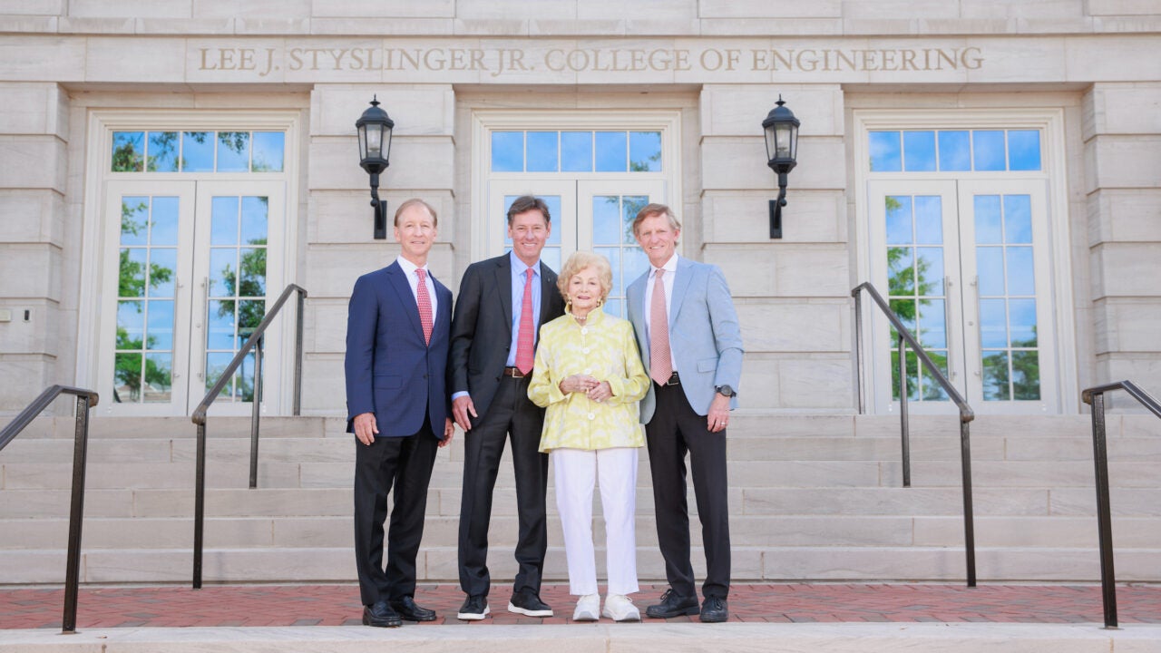 Styslinger family in front of H.M. Comer Hall