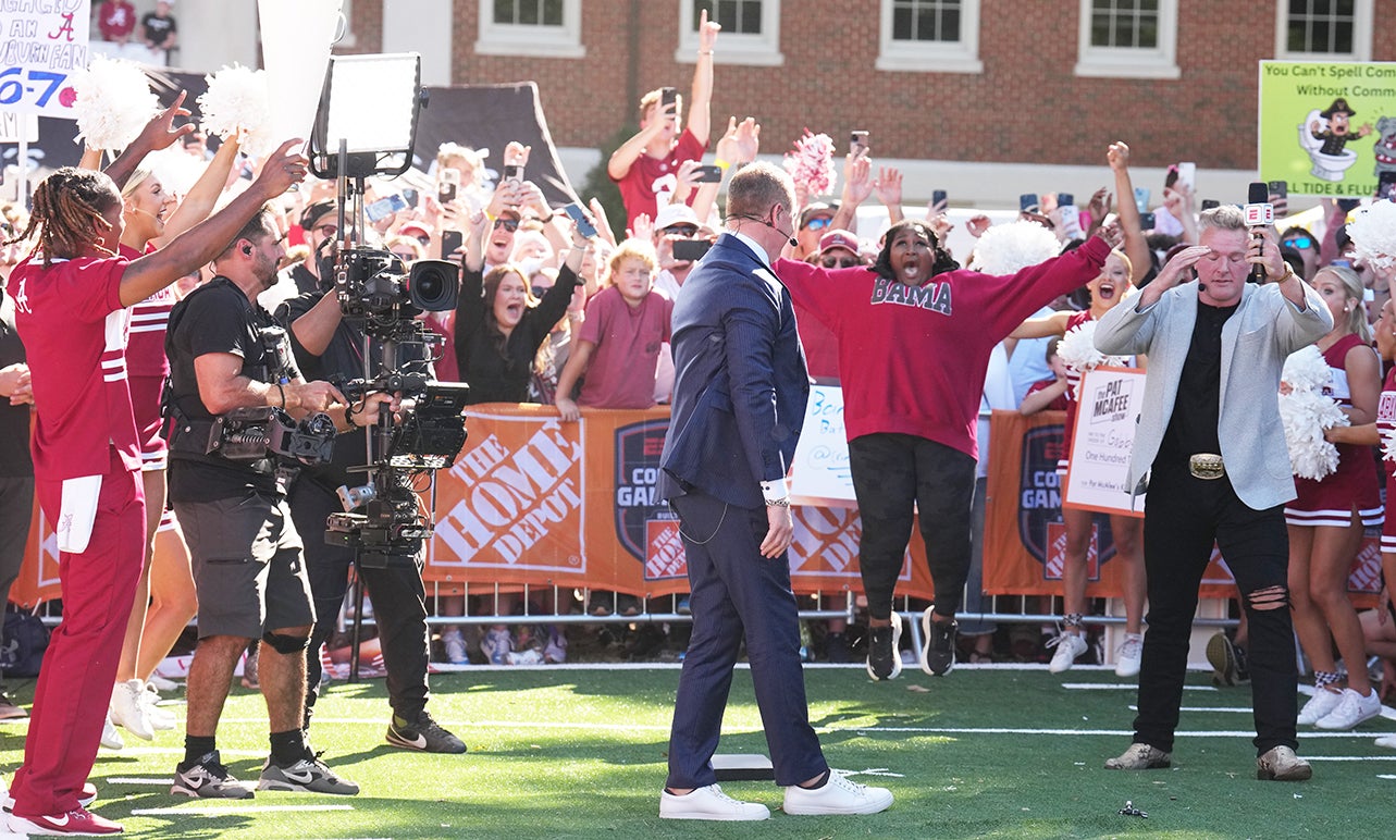 A celebratory scene from College Gameday with Kirk Herbstreit, Gabby Mathis, Pat McAfee