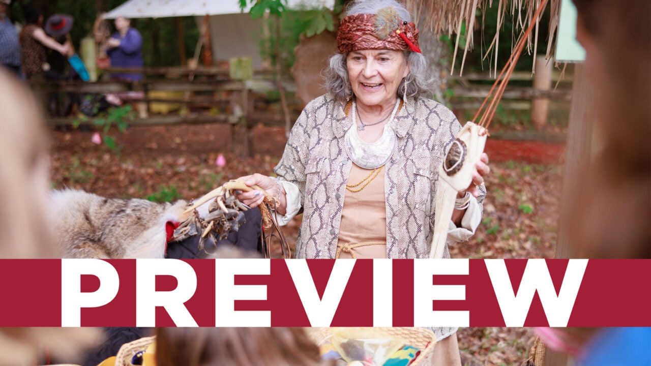 A Moundville Native American Festival exhibitor talking to guests