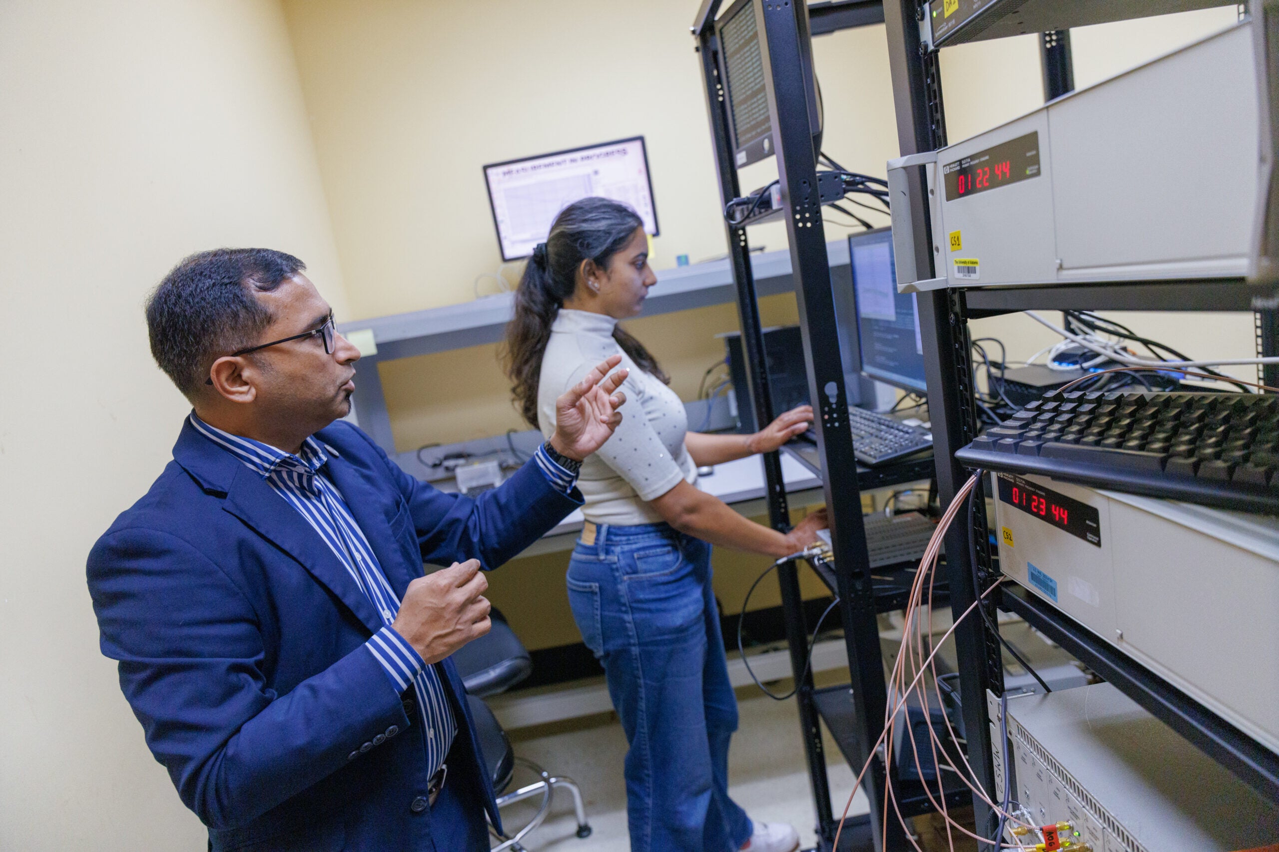 Dr. Bandi with graduate student Jahnvi Verma with the UA atomic clock ensemble