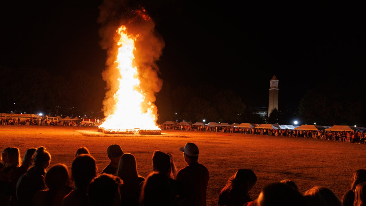 the bonfire burns on the quad with denny chimes in the background