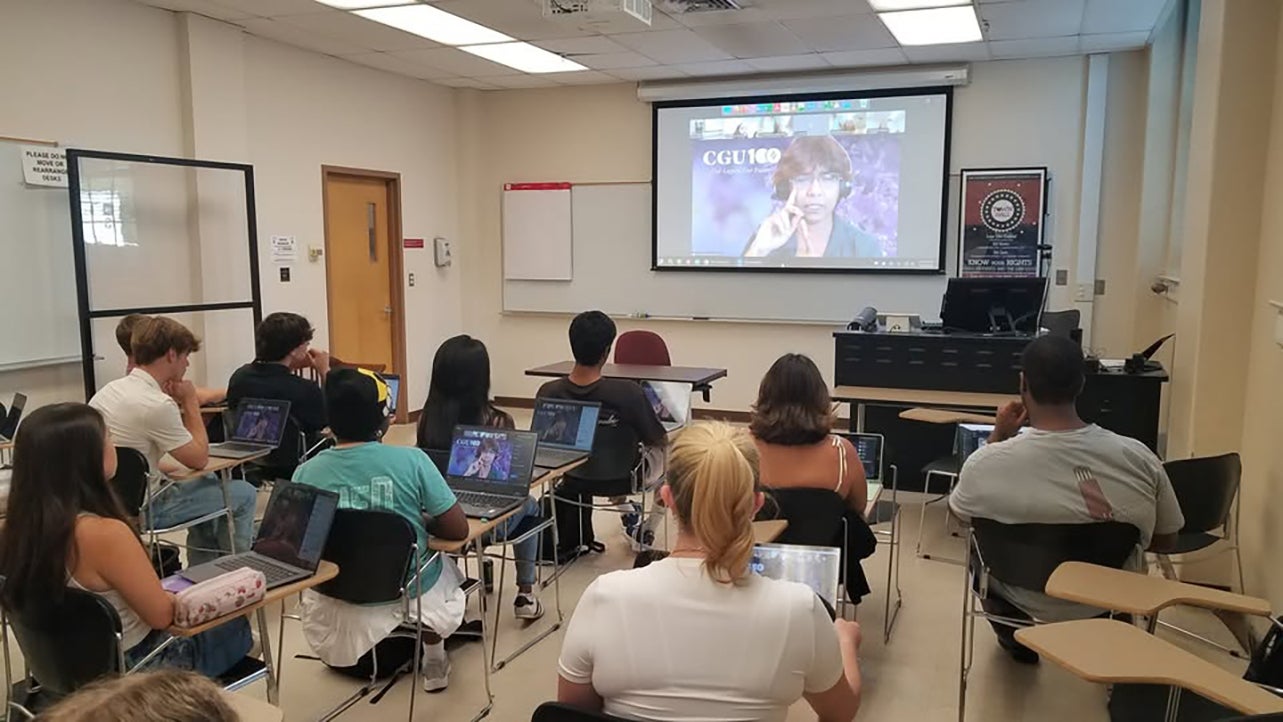 Achieve Scholars students listen to a remote video lecture.