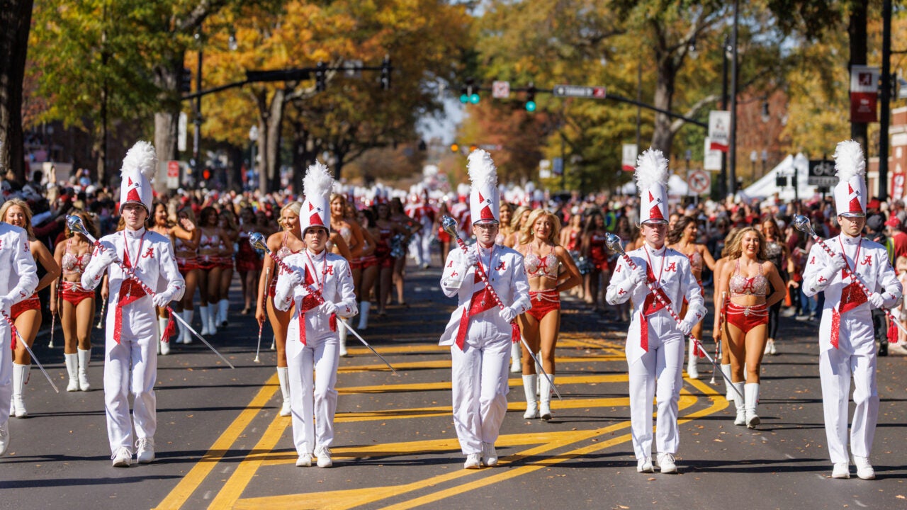 the million dollar band leads the parade down university boulevard