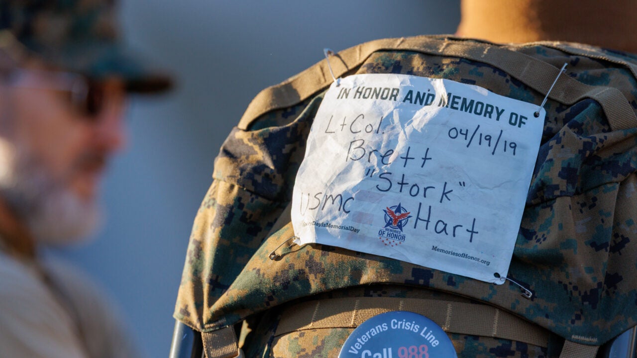 a label on a rucksack says "in honor and memory of lieutenant colonel Brett Stork Hart