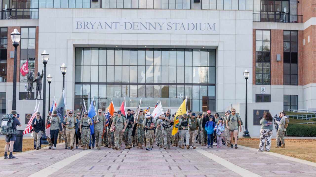 the iron ruck crowd departs on the walk of champions