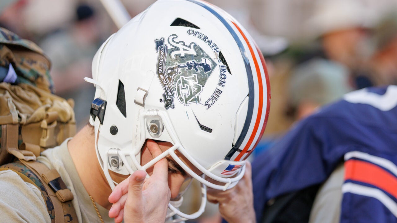 closeup on a rucker wearing a football helmet that days "operation Iron Ruck"