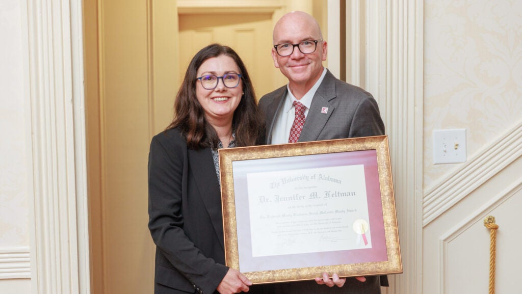 Dr. Feltman receives the award from Dr. Mohler