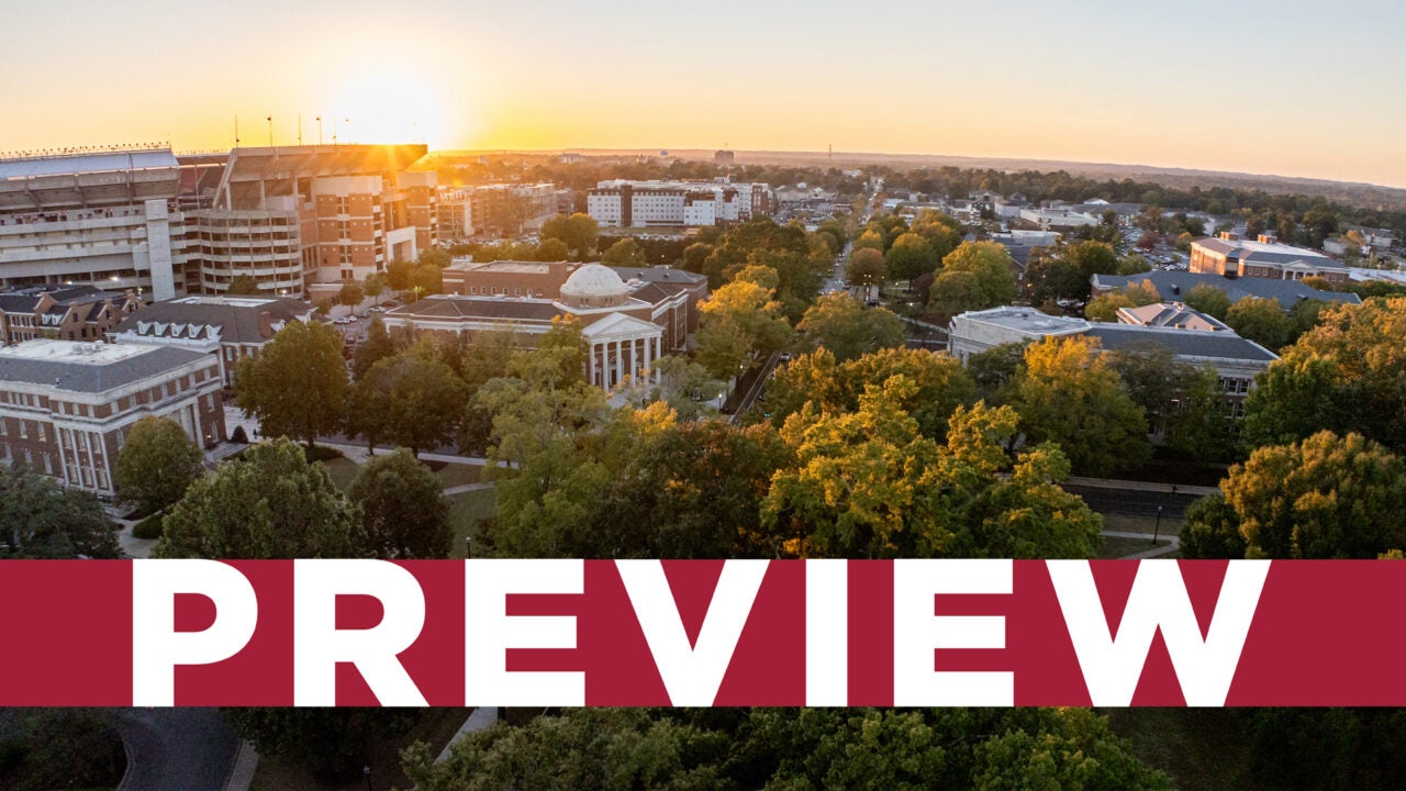 An aerial view of campus with Reese Phifer Hall and Saban Field at Bryant Denny Stadium in the background