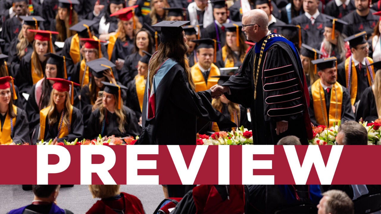 A graduate shaking hands with President Mohler during a previous commencement ceremony