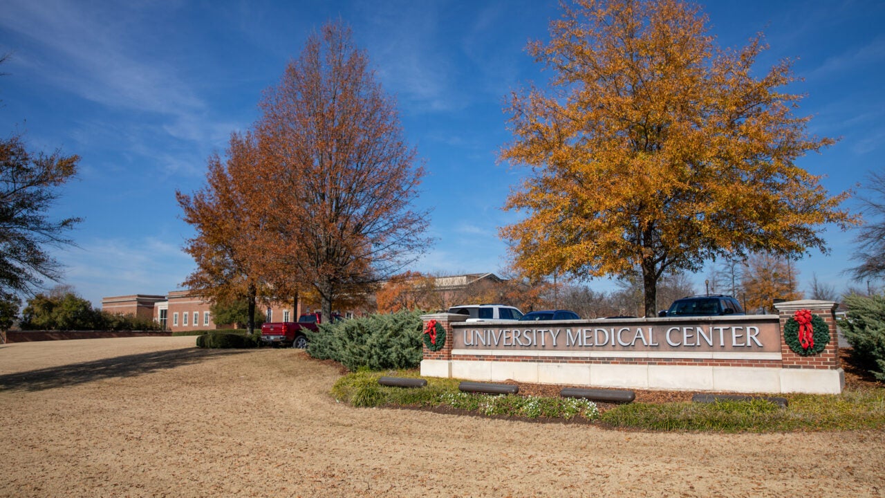 The University Medical Center sign with holiday wreaths on both ends