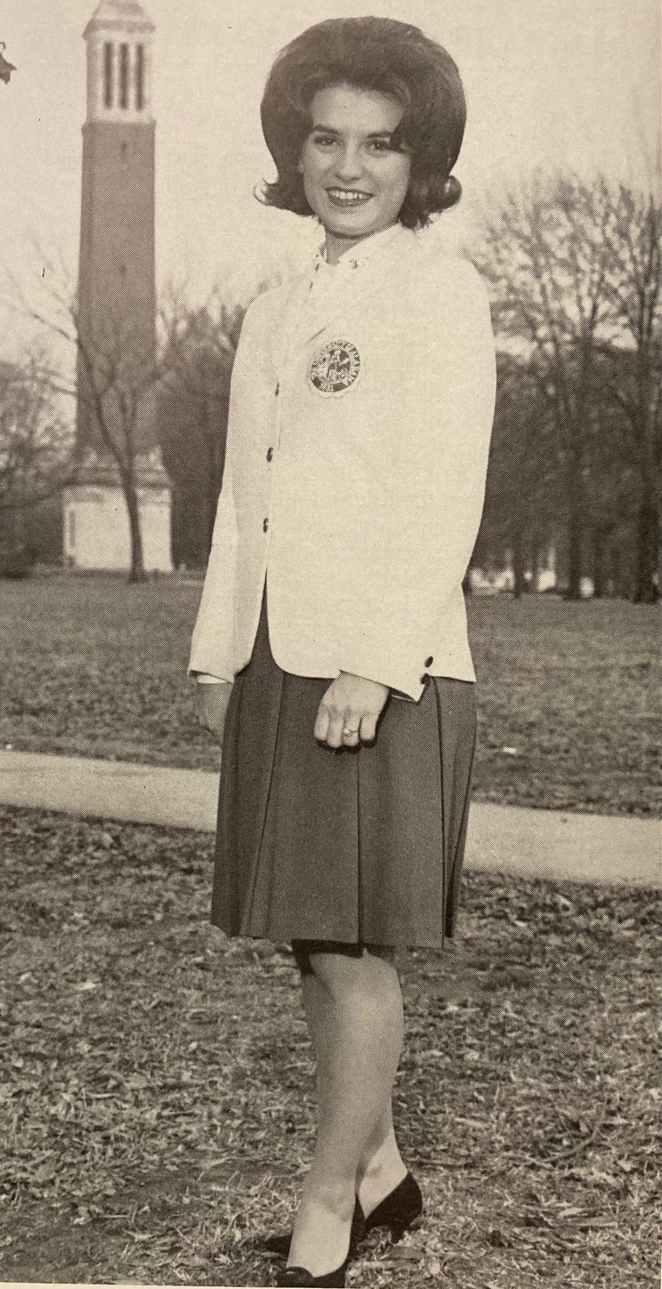 A 1964 member of Crimson Girls stands in front of Denny Chimes.