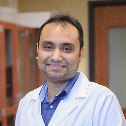 Shreyas Rao, associate professor of chemical and biological engineering, wearing a lab coat