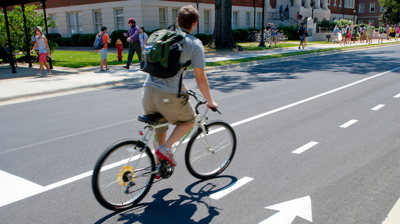 A man riding a bicycle.