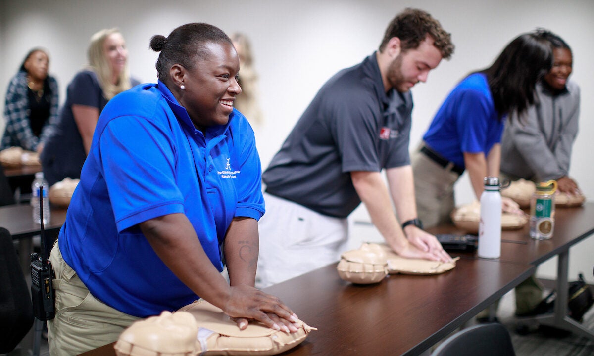 UA staff members practice CPR