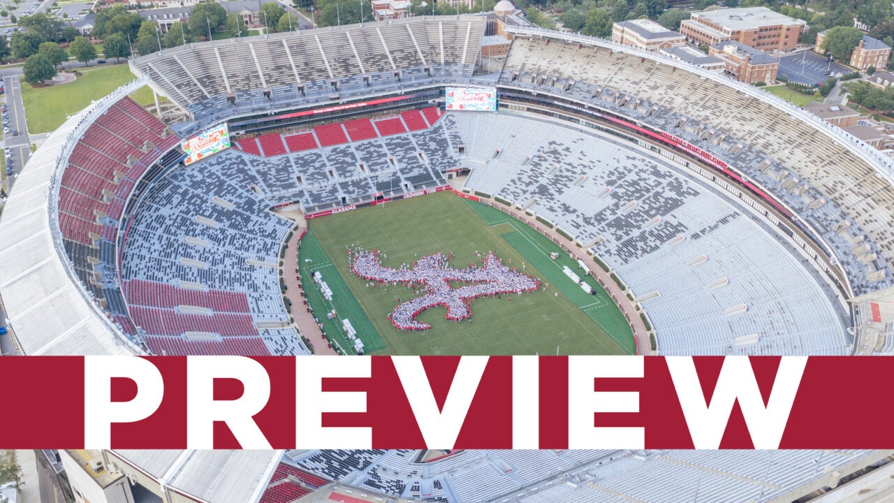 An aerial view of student forming the script A on Saban Field at Bryant Denny Stadium